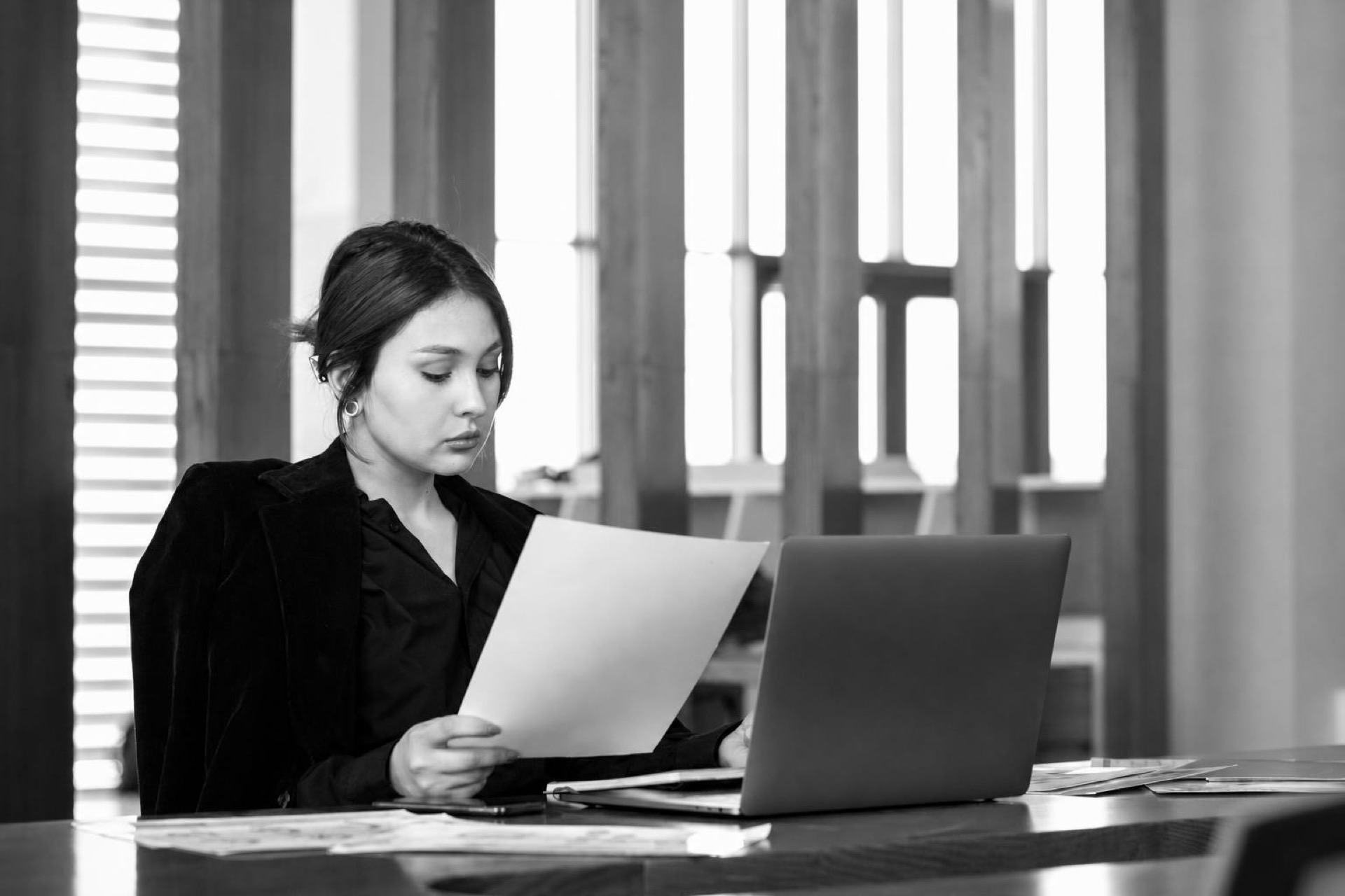 A founder reviewing an employee compliance dashboard on a laptop