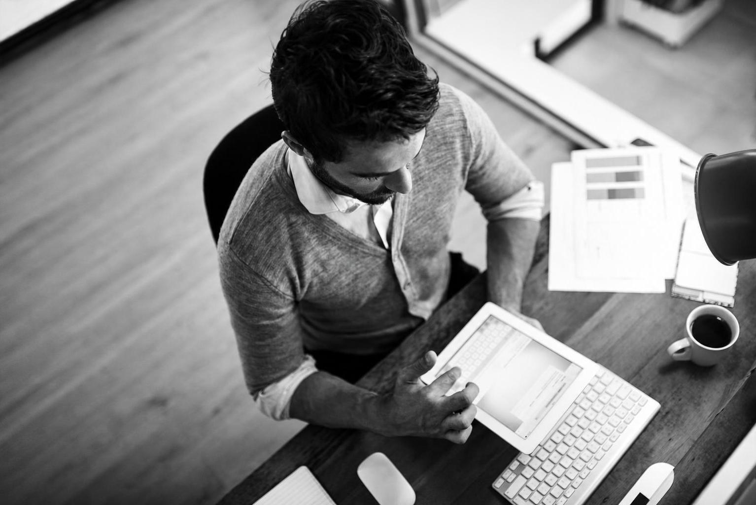 A founder reviewing project metrics and charts to evaluate build quality without reading code