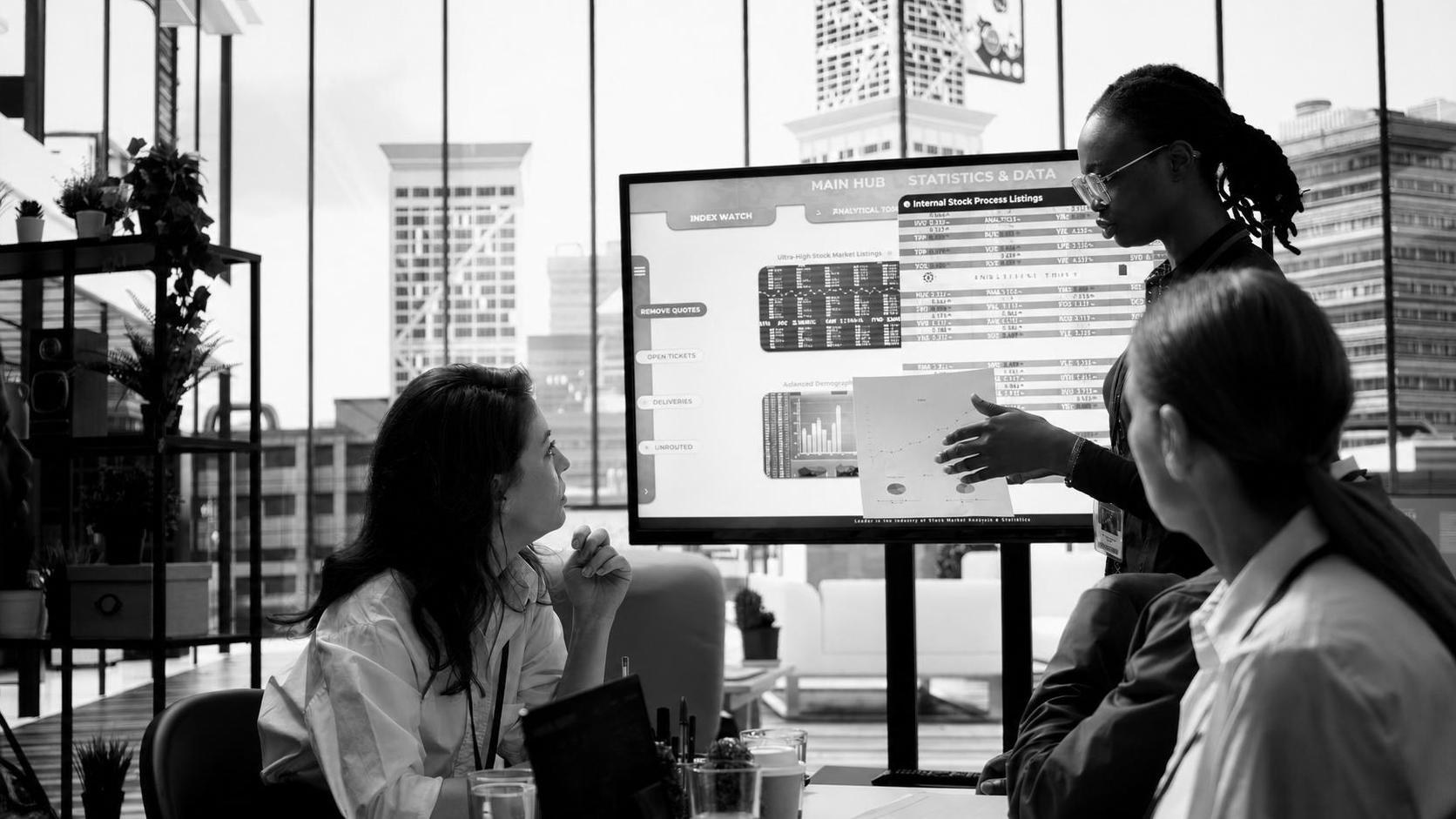 A software development team reviewing a staging environment build during a sprint