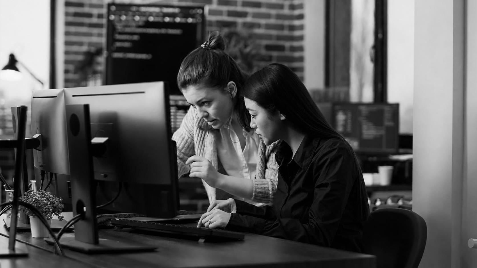 A software development team reviewing test coverage results on a shared screen
