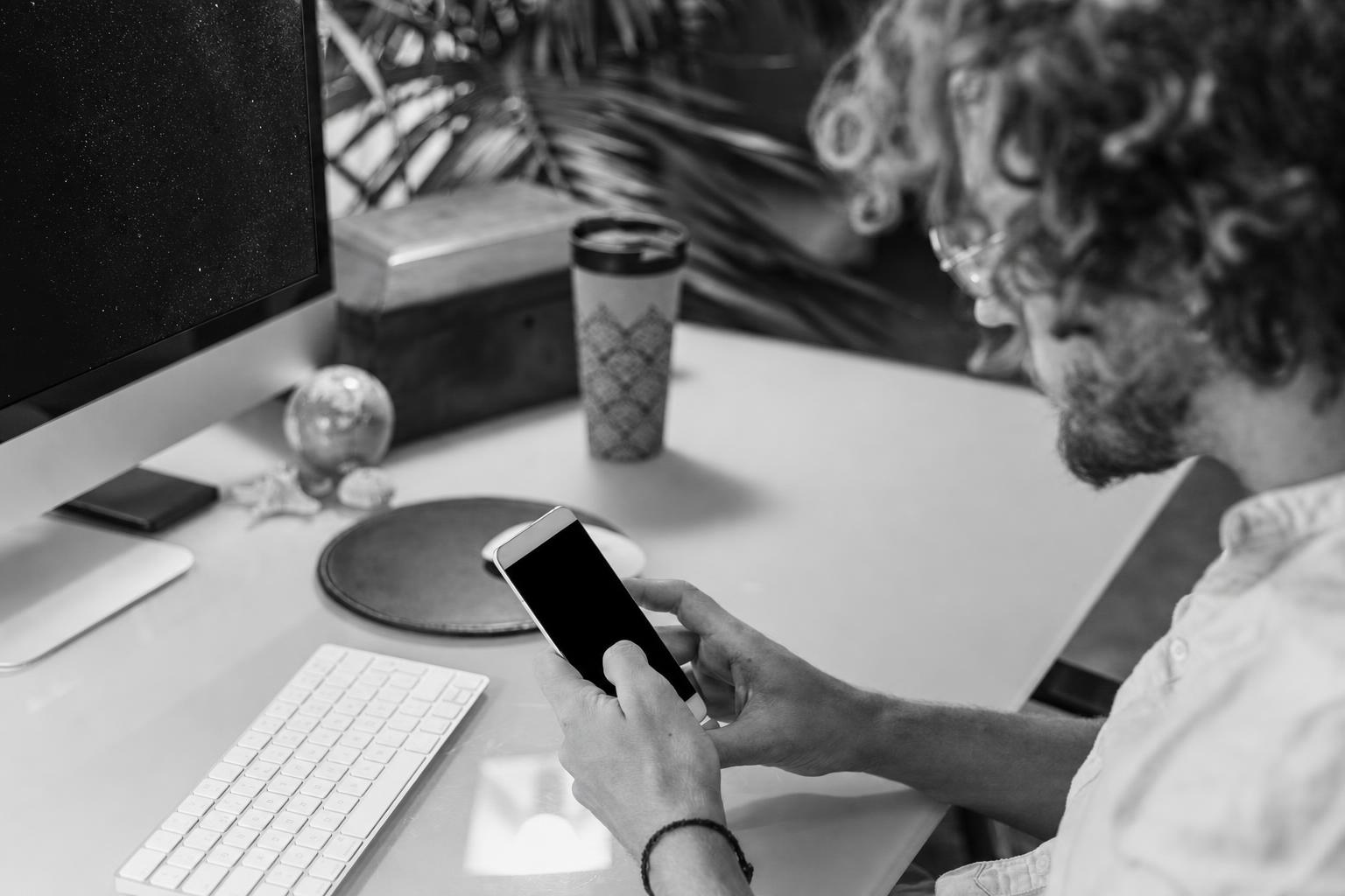 A person testing a product's core function alone at a desk