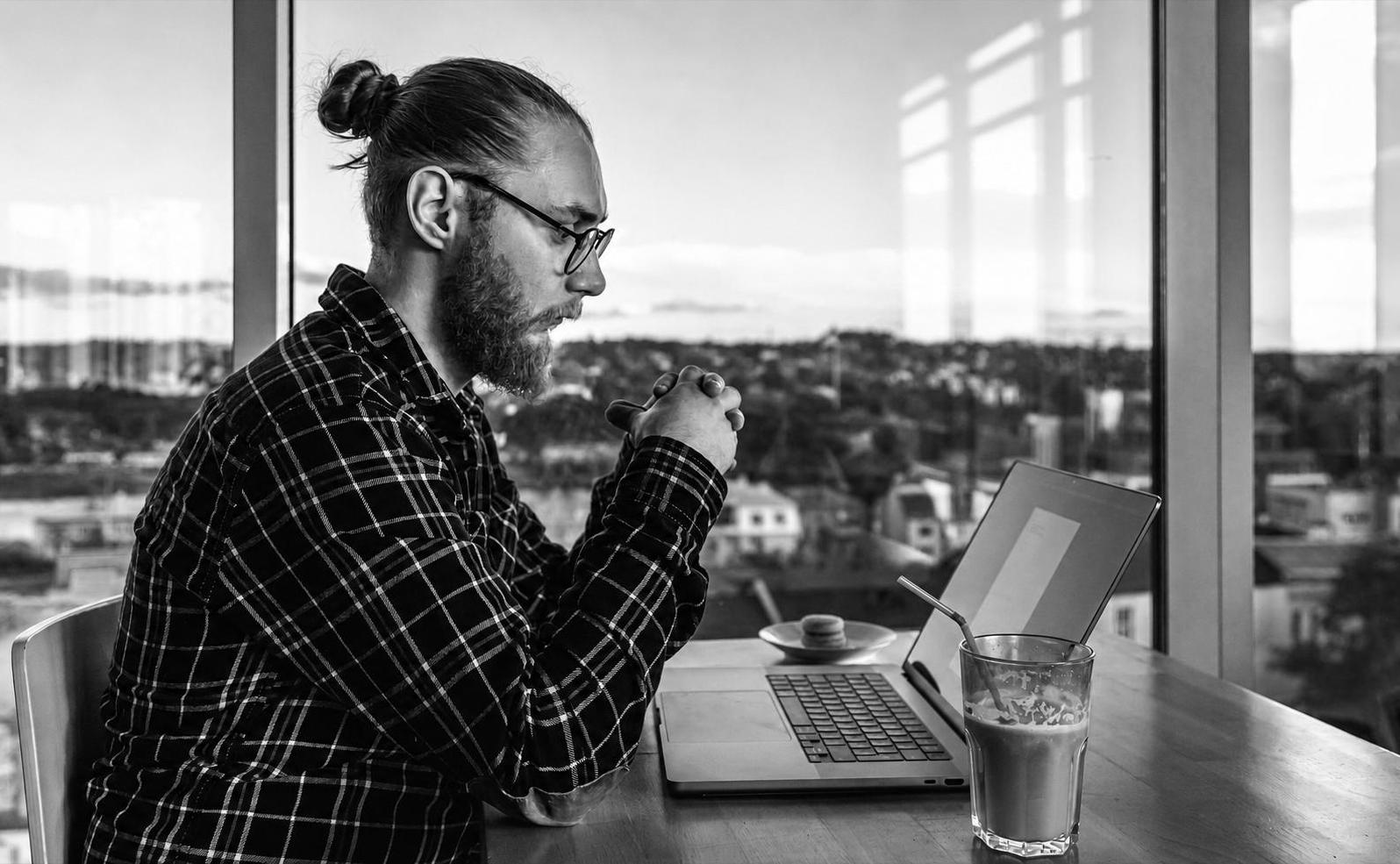Founder focused on a laptop, quickly validating an idea